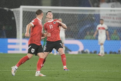 Michael Gregoritsch celebrates scoring Austria's first goal